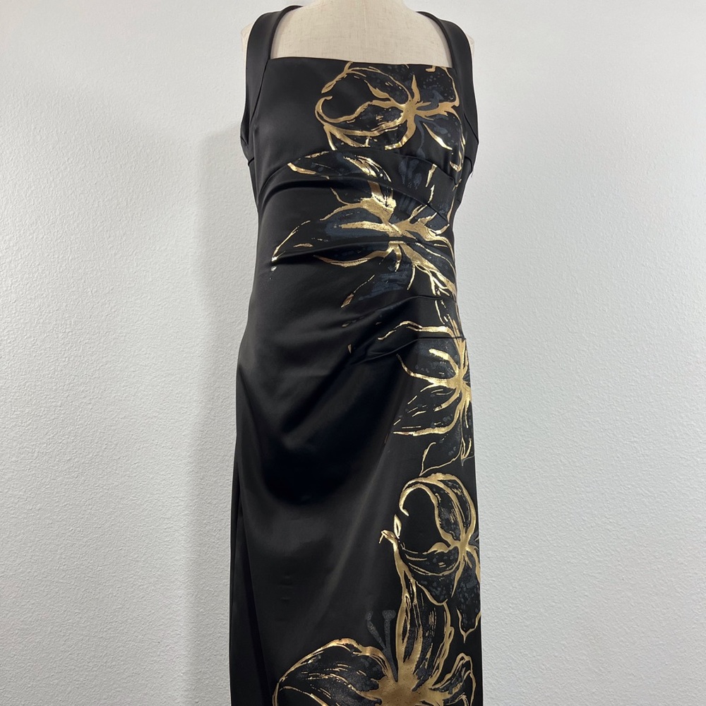 This dress is a  Cache black dress with gold floral design in size 2